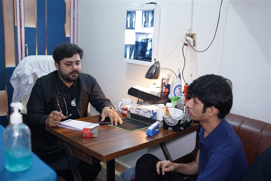Executive Director reviewing a patient's file during consultation