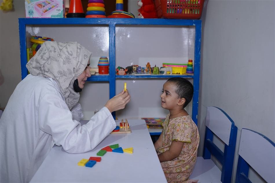 Speech therapist working with a young child